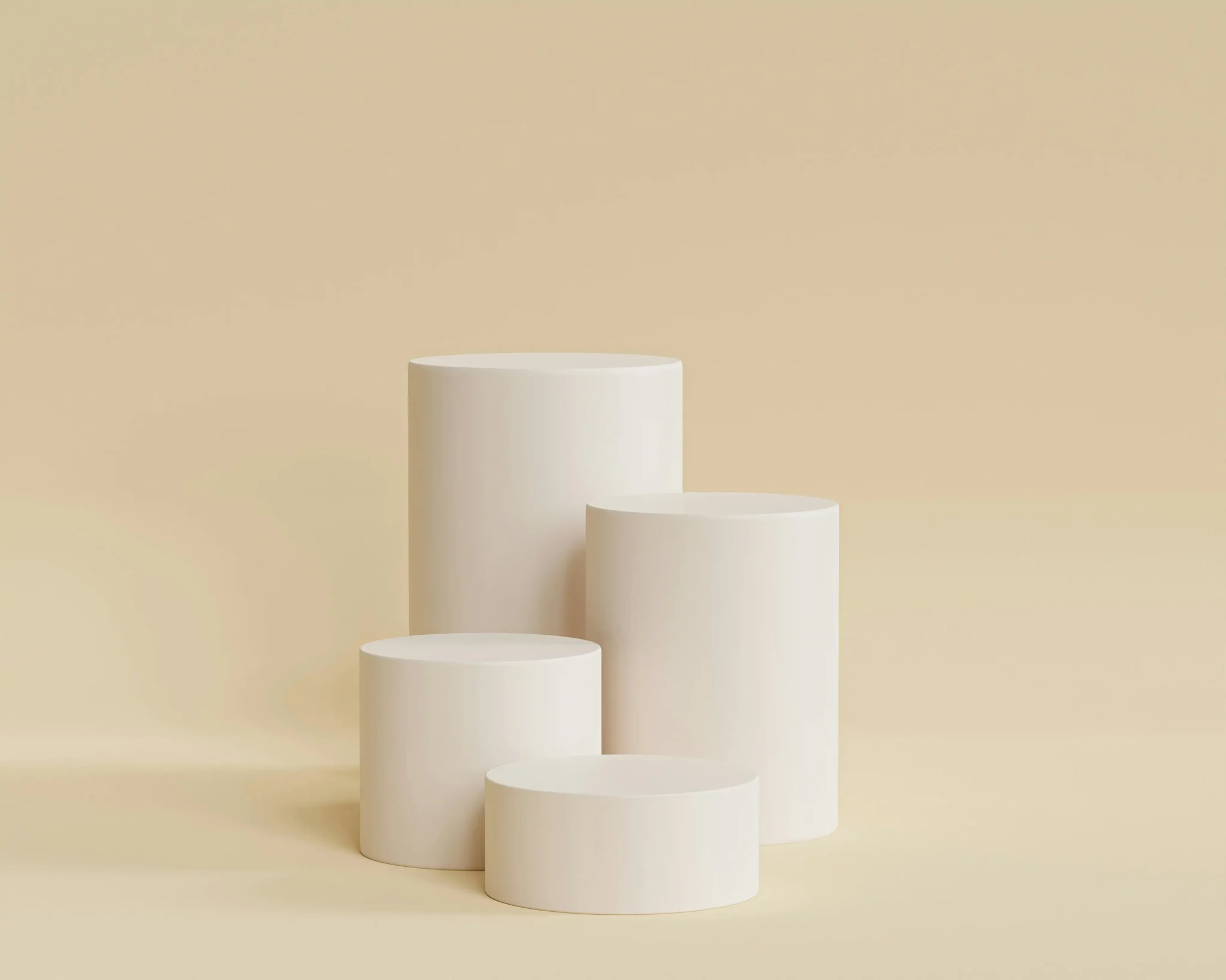 Rendu 3D de podiums cylindriques de différentes hauteurs pour la mise en valeur de produits